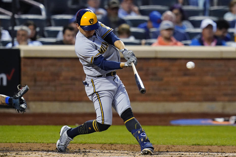 Milwaukee Brewers' Luis Urias hits a single during the fourth inning of the team's baseball game against the New York Mets on Thursday, June 16, 2022, in New York. (AP Photo/Frank Franklin II)