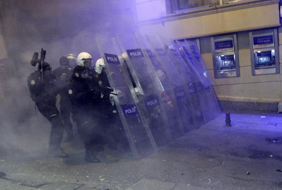 Riot police take positions as they clash with demonstrators during a protest against internet censorship in Istanbul