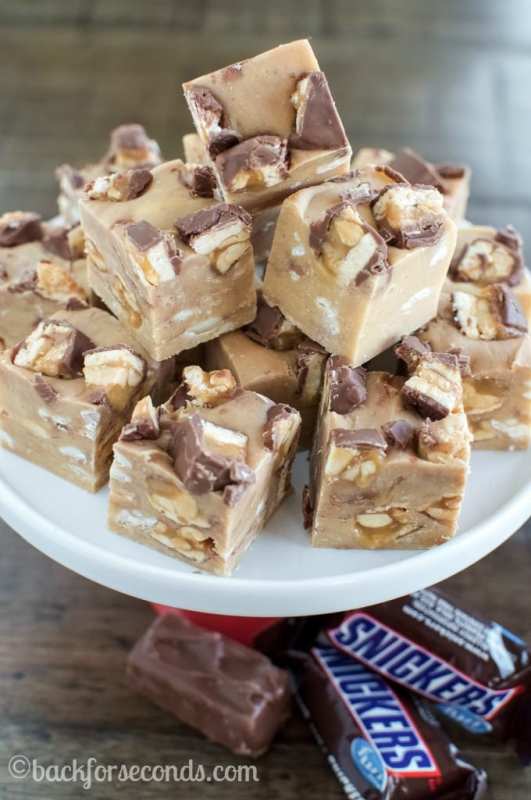 <p>Back for Seconds</p><p>Easy Peanut Butter Snickers Fudge takes just a handful of ingredients and a few minutes to make—no candy thermometer needed!—and the result is incredible! </p><p><strong>Get the recipe: </strong><strong><a href="https://backforseconds.com/easy-peanut-butter-snickers-fudge/" rel="nofollow noopener" target="_blank" data-ylk="slk:Easy Peanut Butter Snickers Fudge;elm:context_link;itc:0;sec:content-canvas" class="link ">Easy Peanut Butter Snickers Fudge</a></strong></p><p><strong>Related: <a href="https://parade.com/212121/stefanipollack/homemade-halloween-candy-recipes/" rel="nofollow noopener" target="_blank" data-ylk="slk:9 Homemade Halloween Candy Recipes;elm:context_link;itc:0;sec:content-canvas" class="link ">9 Homemade Halloween Candy Recipes</a></strong></p>