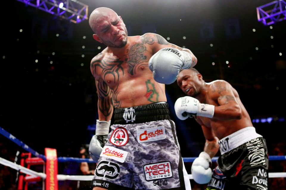 NEW YORK, NY - DECEMBER 01: Miguel Cotto reacts after a low blow from Austin Trout in their WBA Super Welterweight Championship title fight at Madison Square Garden on December 1, 2012 in New York City. (Photo by Elsa/Getty Images)