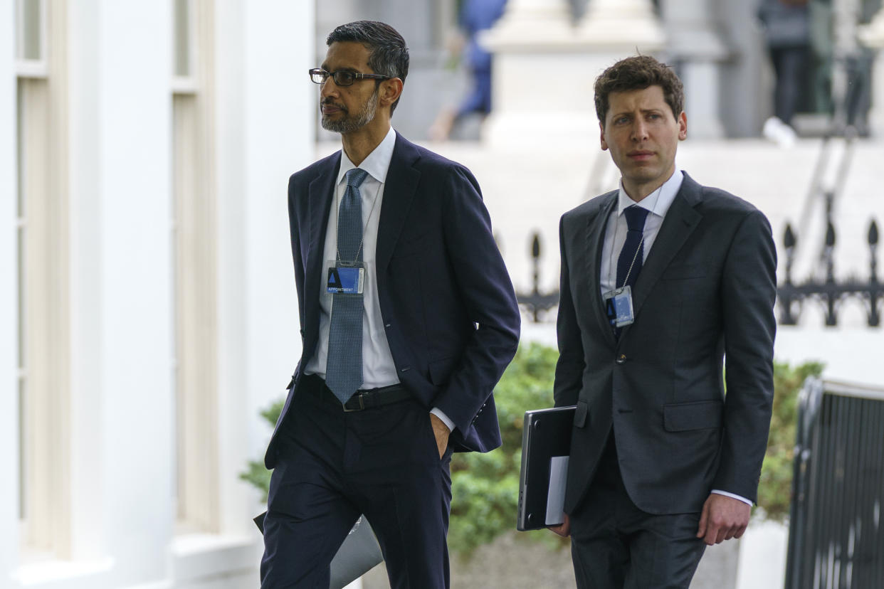 Alphabet CEO Sundar Pichai, left, and OpenAI CEO Sam Altman arrive to the White House for a meeting with Vice President Kamala Harris on artificial intelligence, Thursday, May 4, 2023, in Washington. (AP Photo/Evan Vucci)