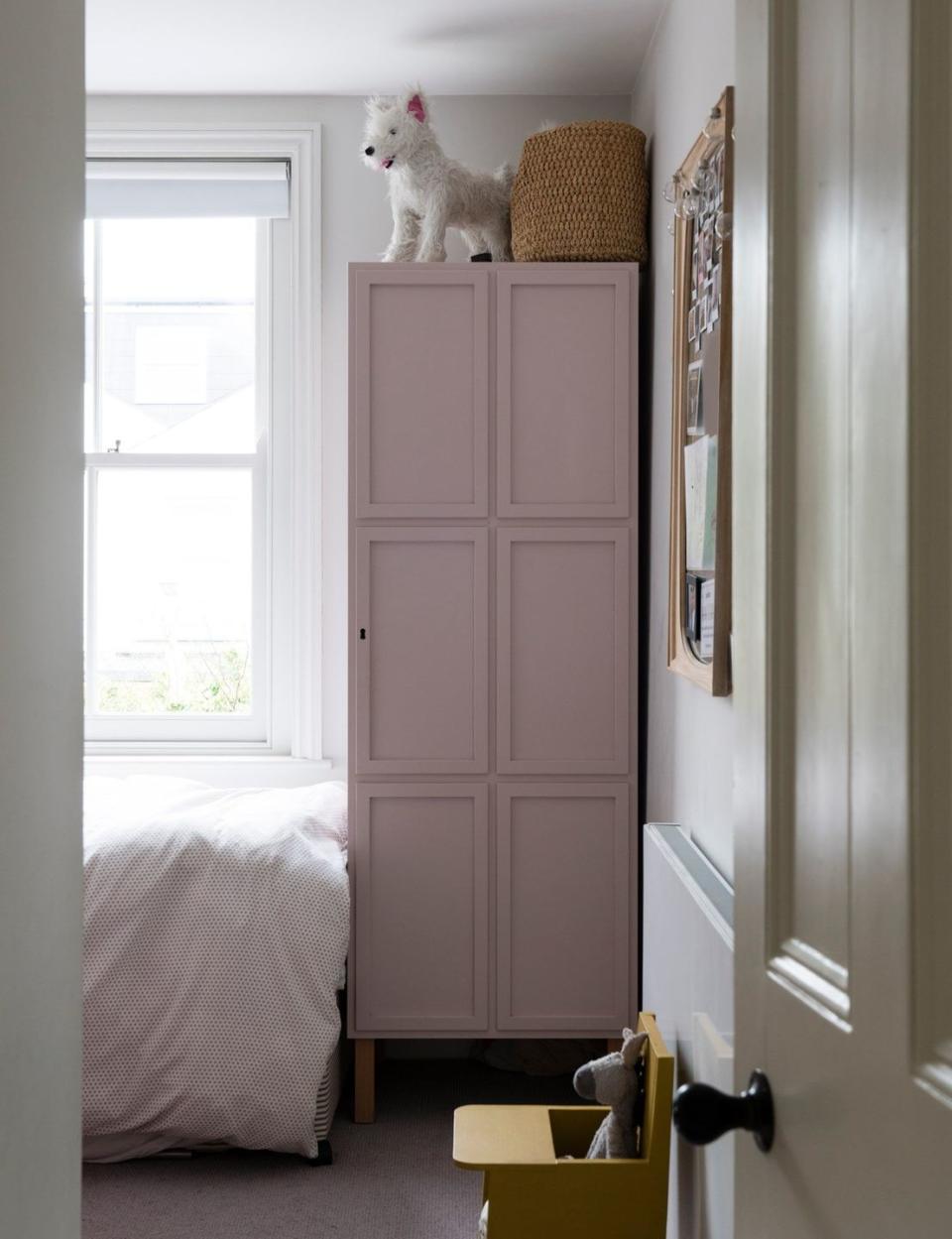 <p>Tall storage will make the most of the vertical space in your playroom, as well as providing a spot to keep things out of reach of little hands. </p><p>Pictured: <a href="https://www.farrow-ball.com/paint-colours/peignoir" rel="nofollow noopener" target="_blank" data-ylk="slk:Cabinet painted in Peignoir at Farrow & Ball;elm:context_link;itc:0;sec:content-canvas" class="link ">Cabinet painted in Peignoir at Farrow & Ball</a></p>