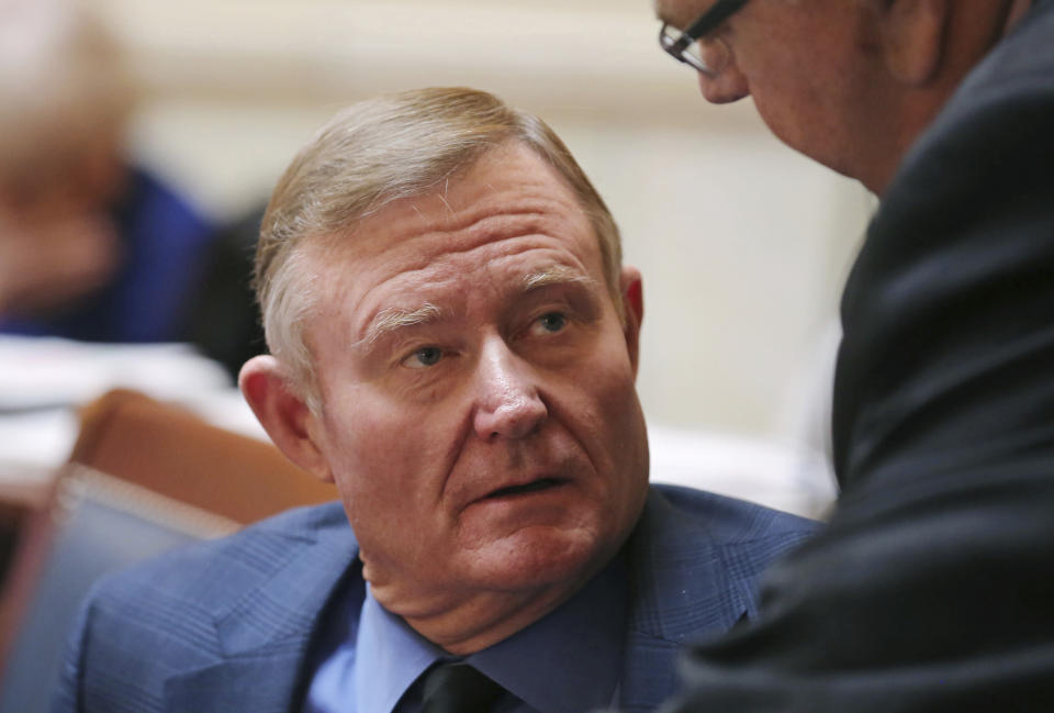 FILE - This Feb. 20, 2018, file photo, shows Republican Sen. Evan Vickers on the Senate floor, at the Utah State Capitol, in Salt Lake City. Utah legislators are drafting a proposal to scrap a planned state-run medical cannabis dispensary system after facing pressure from county attorneys who said the system put public employees at risk of being prosecuted under federal drug laws. Republican Senate Majority Leader Vickers says medical cannabis would instead be distributed through up to 12 private dispensaries. (AP Photo/Rick Bowmer, File)