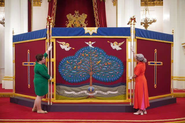 <p>Yui Mok/PA Images via Getty Images</p> The anointing screen used at King Charles' coronation displayed at Buckingham Palace