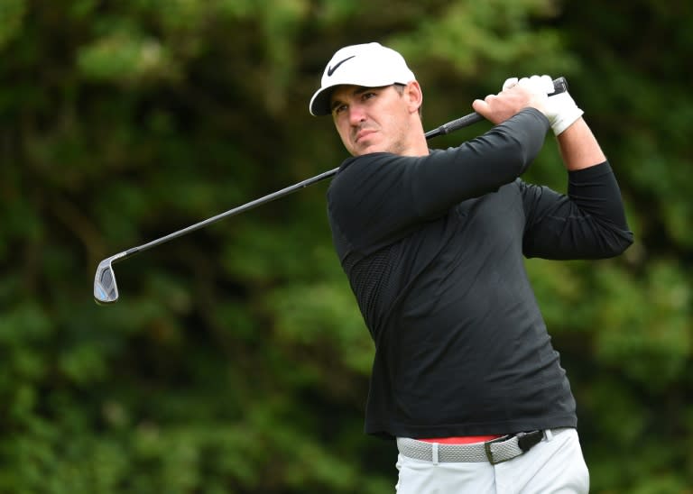 US golfer Brooks Koepka watches his iron shot from the 5th tee on July 20, 2017