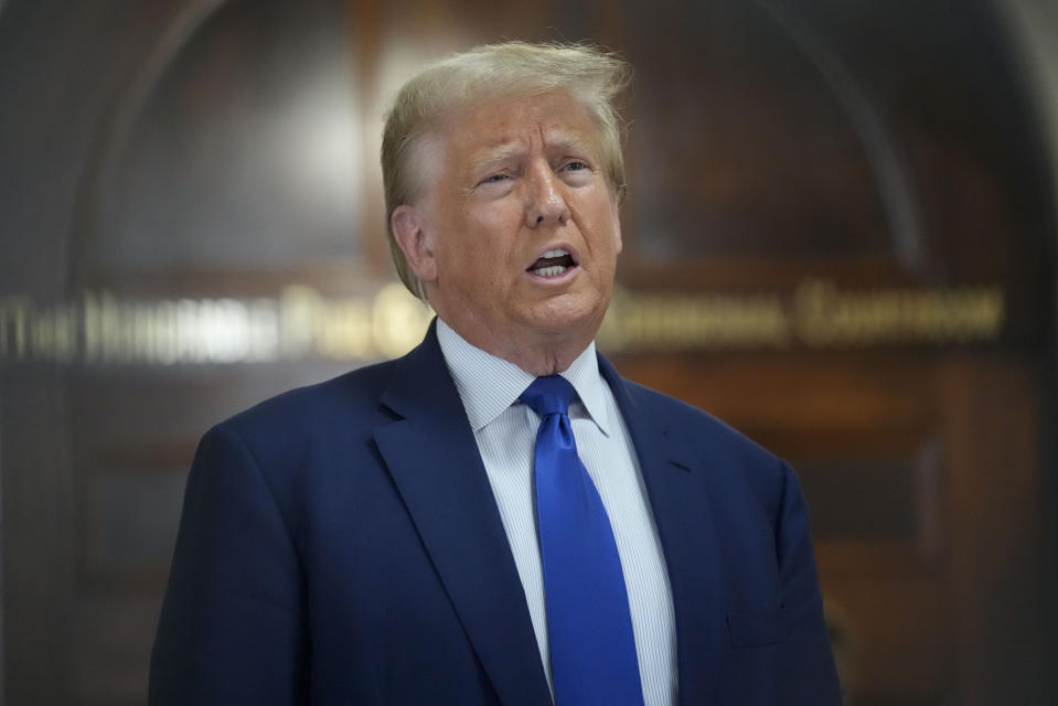 Former President Donald Trump speaks during a break in his civil business fraud trial at New York Supreme Court, Wednesday, Oct. 25, 2023, in New York. The judge in Donald Trump's civil fraud trial has fined the former president $10,000. The judge says Trump violated a limited gag order barring personal attacks on court staffers.(AP Photo/Seth Wenig)