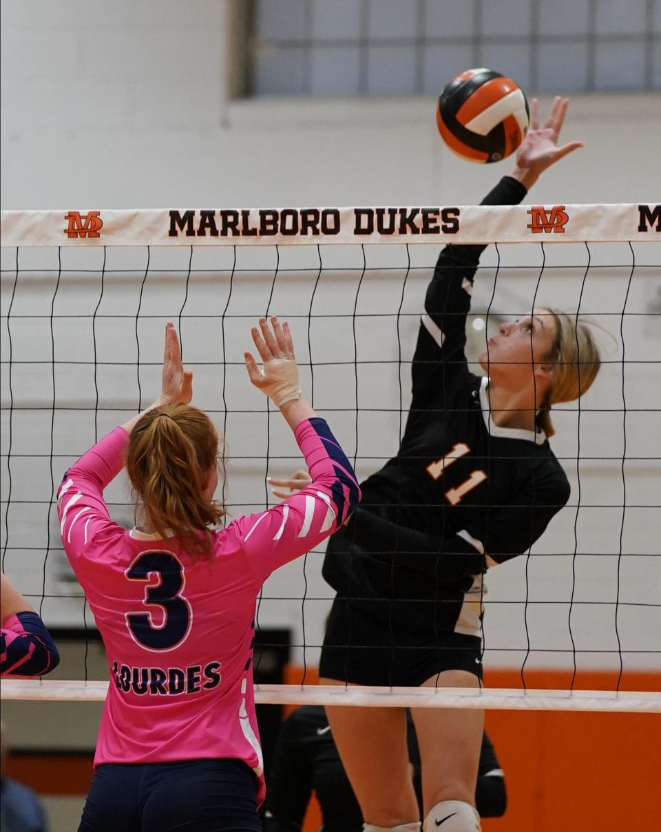 Marlboro's Madi Callahan (11) works a shot as Lourdes' Abigail Anderson (3) works a block during volleyball action at Marlboro High School on Tuesday, October 11, 2022.