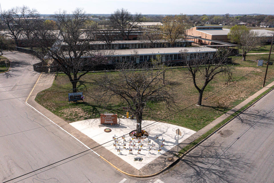 Crosses dedicated to the 21 victims of the 2022 mass shooting at Robb Elementary are placed in front of the school on Feb. 26 in Uvalde, Texas.