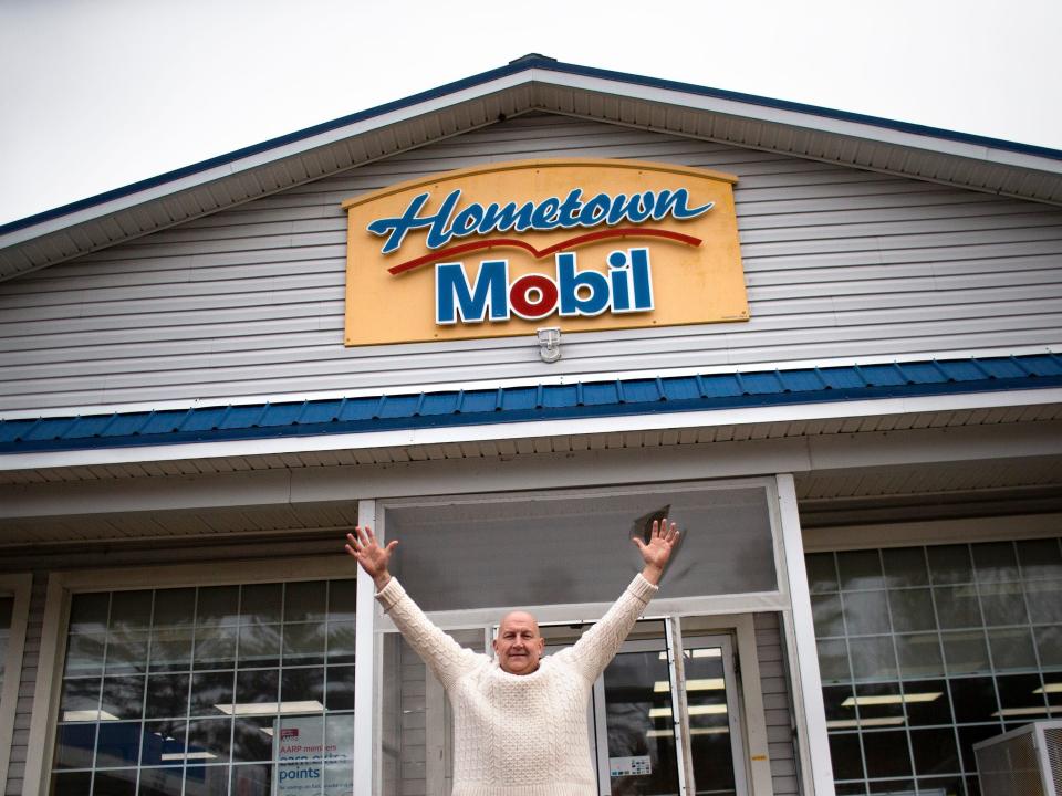 red Cotreau, owner of Hometown Gas and Grill in Lebanon, stands in front of the convenient store where the winning ticket was sold