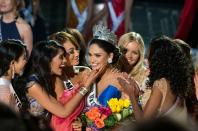 Miss Philippines Pia Alonzo Wurtzbach is congratulated by other contestants after being crowned Miss Universe 2015 in Las Vegas on December 20, 2015