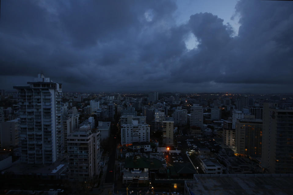 In downtown San Juan, any building with lights on is running a generator. There is no electric utility running on the island. (Photo: Carolyn Cole/Los Angeles Times via Getty Images)