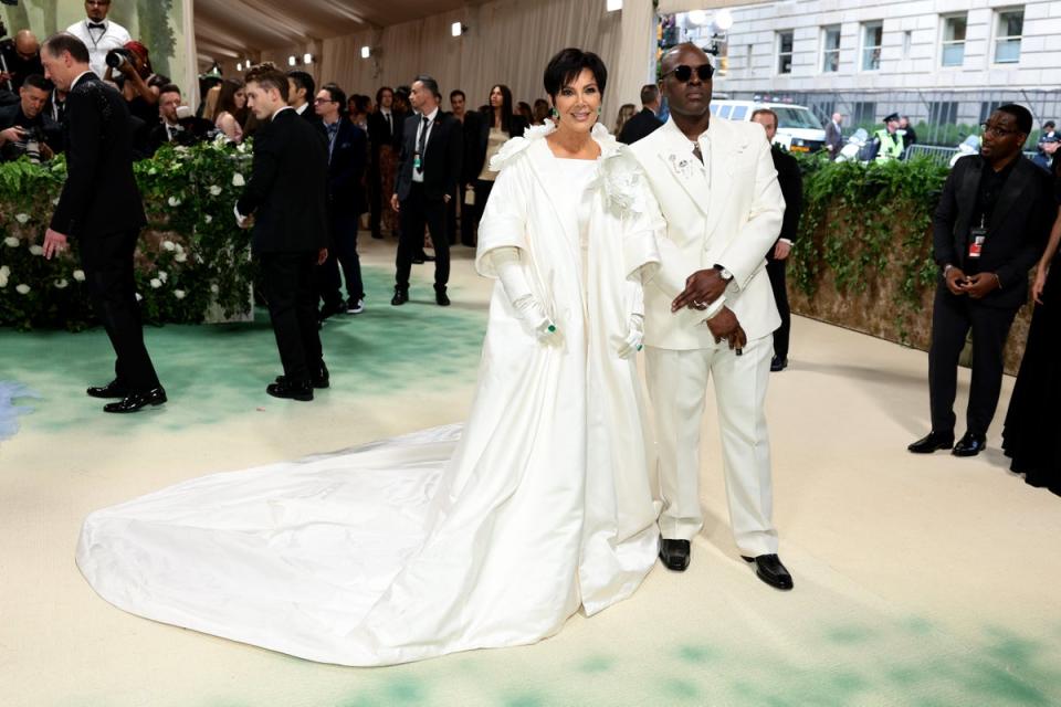 Kris Jenner in Oscar de la Renta and Corey Gamble (Getty Images for The Met Museum)