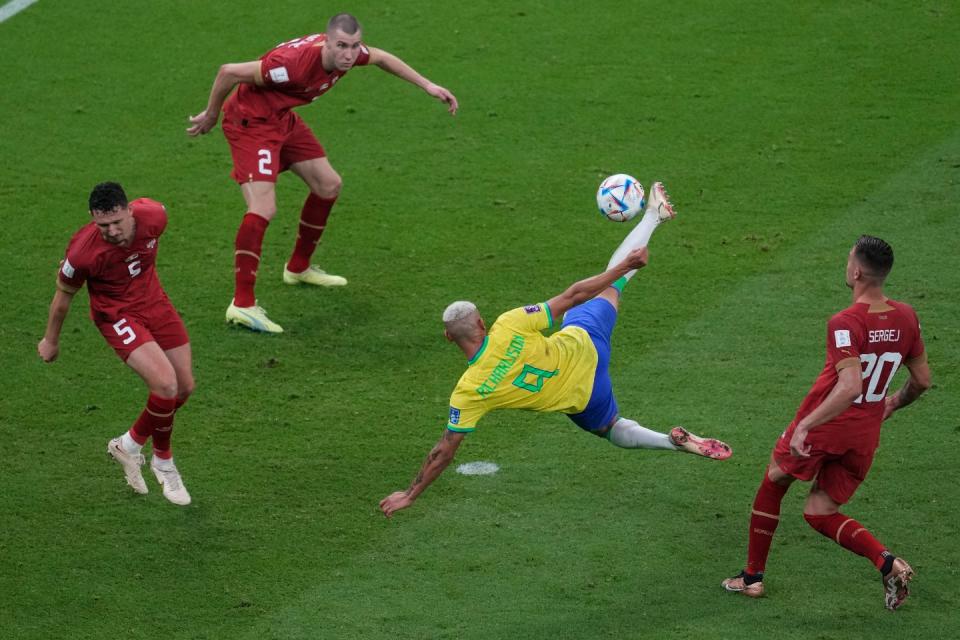 Brazil's Richarlison,second right, scores the second goal of his team against Serbia during the World Cup group G football match between Brazil and Serbia, at the the Lusail Stadium in Lusail, Qatar on Thursday, Nov. 24, 2022. (AP Photo/Darko Vojinovic)