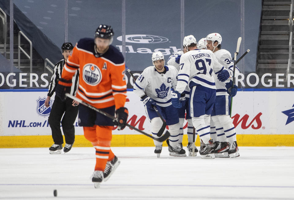 Toronto Maple Leafs celebrate a goal against the Edmonton Oilers during the second period of an NHL hockey game Wednesday, March 3, 2021, in Edmonton, Alberta. (Jason Franson/The Canadian Press via AP)