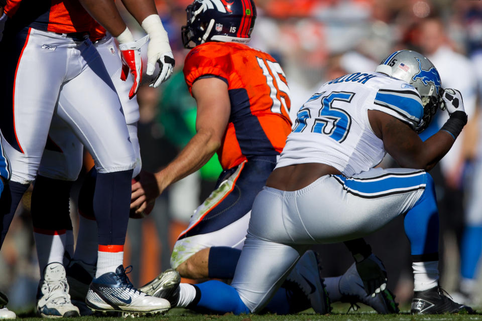 Linebacker Stephen Tulloch #55 of the Detroit Lions reacts by "Tebowing" after making a sack on quarterback Tim Tebow #15 of the Denver Broncos during the first quarter. Tulloch later said he meant no disrespect to Tebow or to his religion. (Photo by Justin Edmonds/Getty Images)