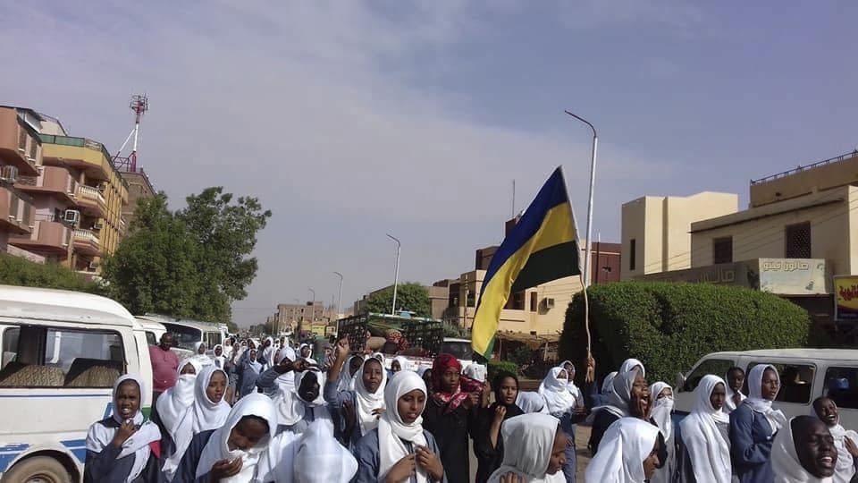 This image provided by the Sudanese Congress Party, shows high school students protesting in Khartoum’s sister city of Omdurman, Sudan, Tuesday, July 30, 2019. Thousands of Sudanese students have taken to the streets in the capital and elsewhere in the country to condemn violence against fellow students. (Sudanese Congress Party via AP)