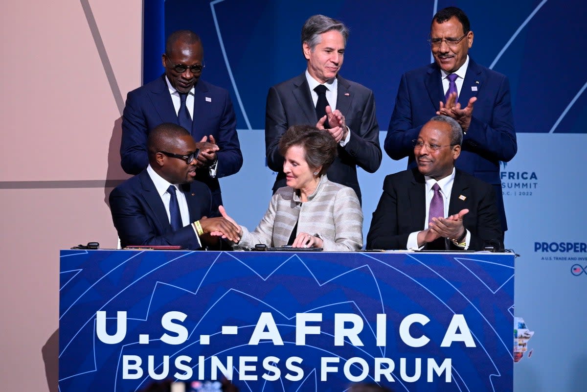 Niger’s Mohamed Bazoum (top right) stands alongside Antony Blinken at the US-Africa Business Forum in Washington last December  (AP)