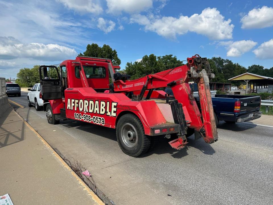 Law enforcement spike strips were used Monday to stop a fleeing Affordable Towing truck at Kansas Expressway.