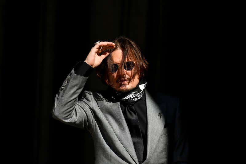 FILE PHOTO: Actors Johnny Depp and Amber Heard at the High Court in London