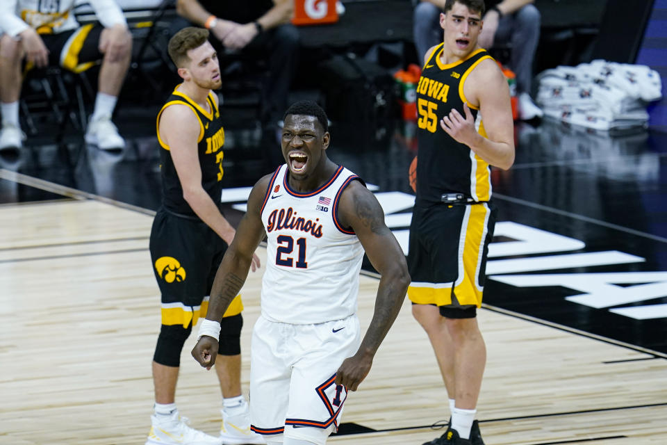 Illinois center Kofi Cockburn (21) celebrates after being fouled on a basket against Iowa in the first half of an NCAA college basketball game at the Big Ten Conference tournament in Indianapolis, Saturday, March 13, 2021. (AP Photo/Michael Conroy)