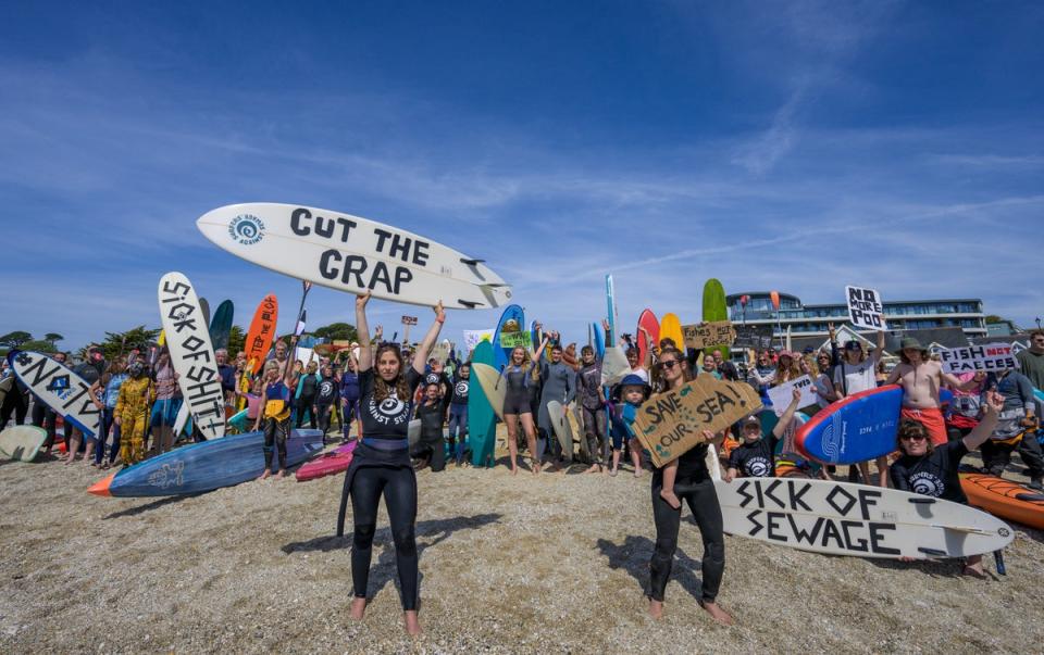 People take part in a protest by Surfers Against Sewage (SAS), in Falmouth (Anthony Upton/PA Media Assignments)