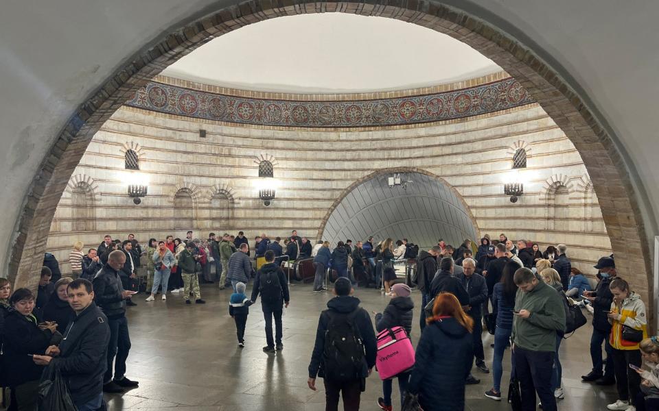 People shelter inside a subway station during a Russian missile attack in Kyiv - Ivan Lyubysh-Kirdey/Reuters