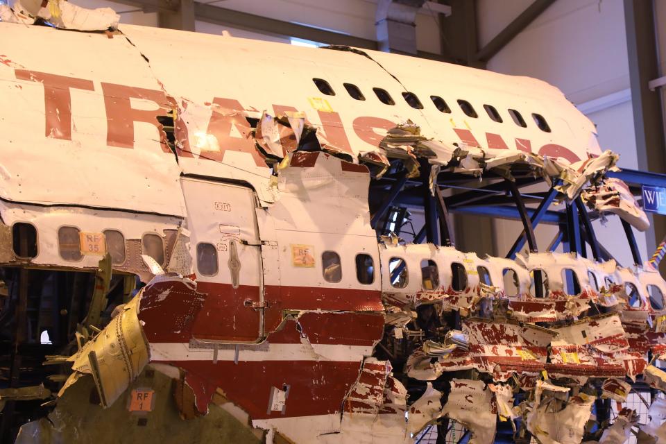 The fuselage of the Boeing 747 that carried TWA Flight 800, which exploded off eastern Long Island and claimed 230 lives on July 17, 1996, is seen in a laboratory facility on the Ashburn, Virginia campus of George Washington University on July 6, 2021.