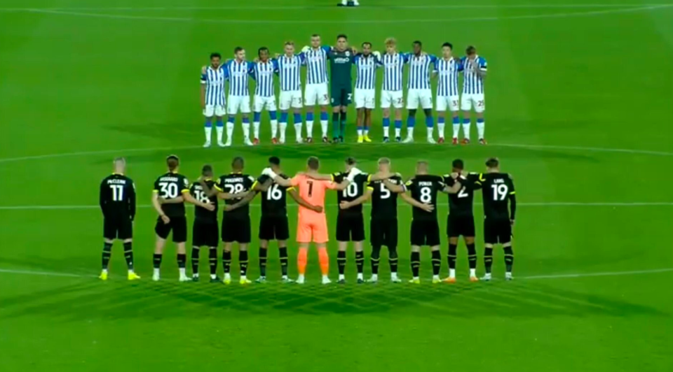 James McClean (bottom left) wore a black armband but did not join with the rest of the players for the one minute silence for the Queen. (Twitter)