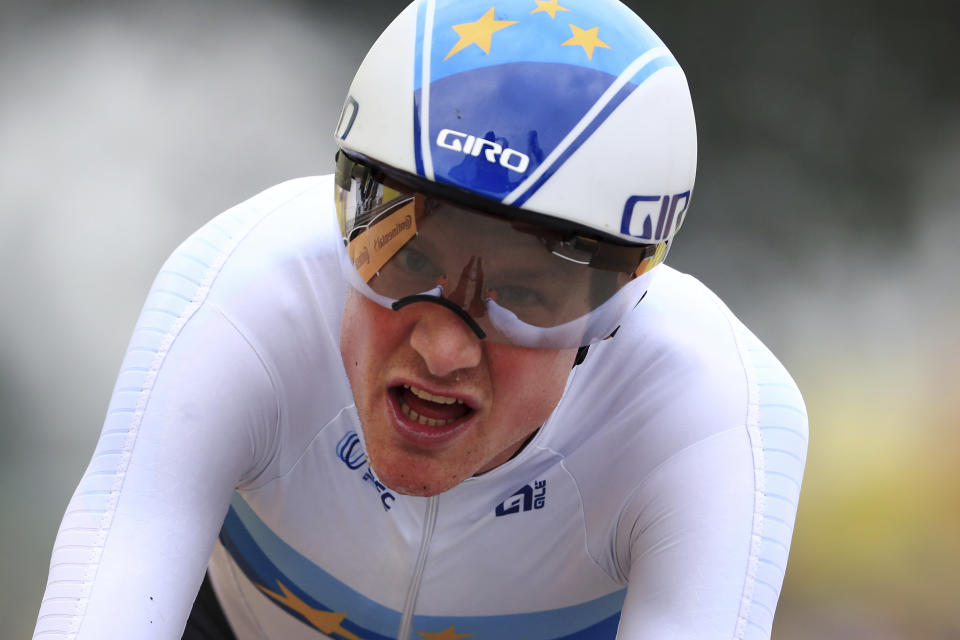 Switzerland's Stefan Kung crosses the finish line of the fifth stage of the Tour de France cycling race, an individual time-trial over 27.2 kilometers (16.9 miles) with start in Change and finish in Laval Espace Mayenne, France, Wednesday, June 30, 2021. (Christophe Petit-Tesson, Pool Photo via AP)