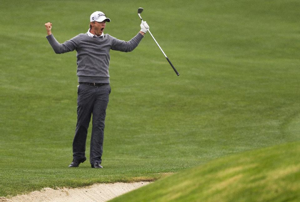 Matt Jones celebrates after chipping in for birdie on a playoff hole against Matt Kuchar to win the Houston Open golf tournament on Sunday, April 6, 2014, in Humble, Texas. (AP Photo/Patric Schneider)