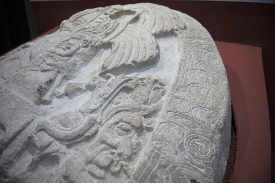 A nearly 1,500-year-old carved altar from the Maya site "La Corona," located in the northern Guatemalan department of Peten, is displayed at the National Museum of Archaeology and Ethnology in Guatemala City, Wednesday, Sept. 12, 2018. Archaeologists in charge of the investigation say that it is the oldest monument found to date in this site of the Classic Maya period. (AP Photo/Oliver de Ros)