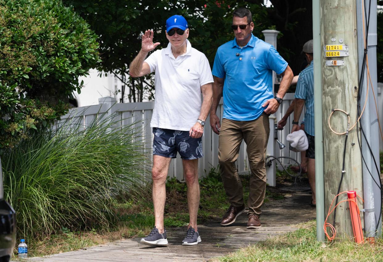 President Joe Biden leaves the beach near his home in Rehoboth Beach, Del., in July. An increase in the value of Biden's two homes in the state accounts for much of the growth in his wealth since he entered the White House, according to Forbes.