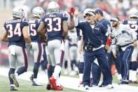 Sep 9, 2018; Foxborough, MA, USA; New England Patriots offensive coordinator Josh McDaniels celebrates with team members after a touchdown against the Houston Texans during the second quarter at Gillette Stadium. Mandatory Credit: Greg M. Cooper-USA TODAY Sports