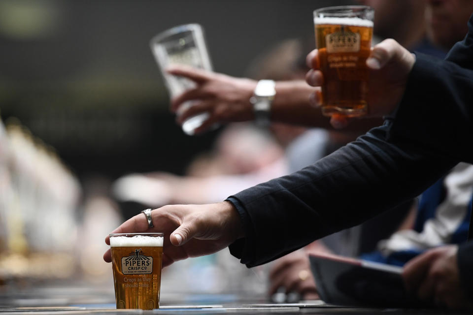 <p>Visitors drink pints of ale and wait to be served at the CAMRA (Campaign for Real Ale) Great British Beer festival at Olympia exhibition center on August 8, 2017 in London, England. (Photo: Carl Court/Getty Images) </p>