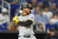 Pittsburgh Pirates' Edward Olivares reacts to a close pitch as he bats during the fifth inning of a baseball game against the Miami Marlins, Friday, March 29, 2024, in Miami. (AP Photo/Wilfredo Lee)