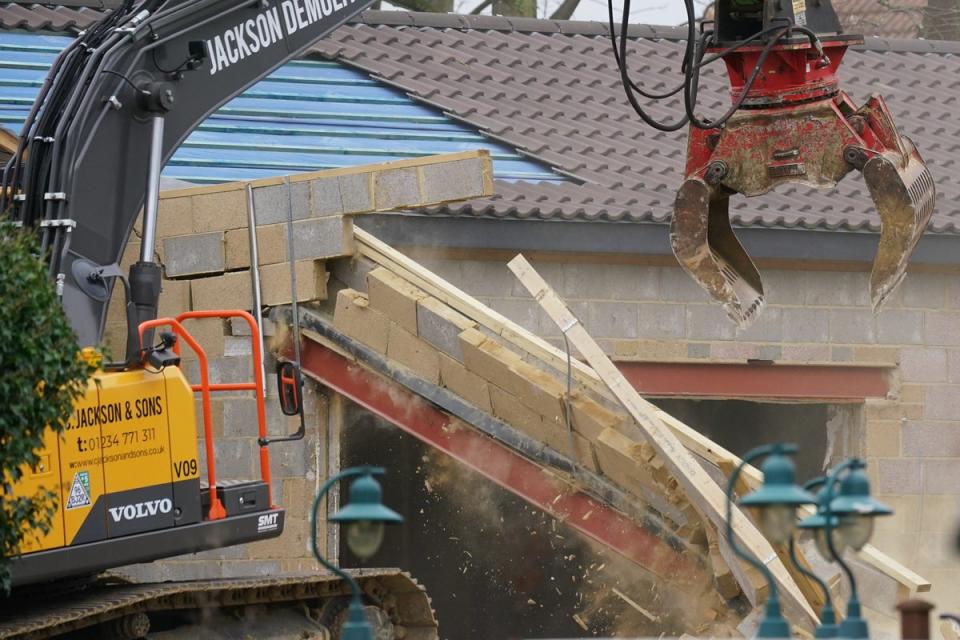 A crane demolishing the spa (Jacob King/PA) (PA Wire)