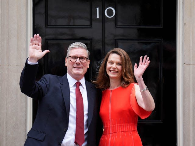 Newly elected Prime Minister Sir Keir Starmer and his wife Victoria Starmer arrive at his official London residence at No 10 Downing Street for the first time after the Labour Party won a landslide victory at the 2024 General Election