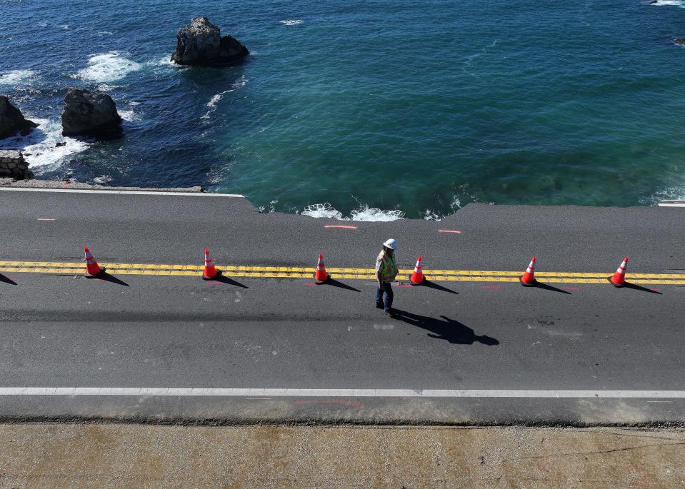 In an aerial view, a section of southbound Highway 1 that broke off and fell in the ocean at Rocky Creek Bridge is visible on April 02, 2024 near Big Sur, California. A section of California's famed Highway 1 collapsed into the ocean following heavy rains.