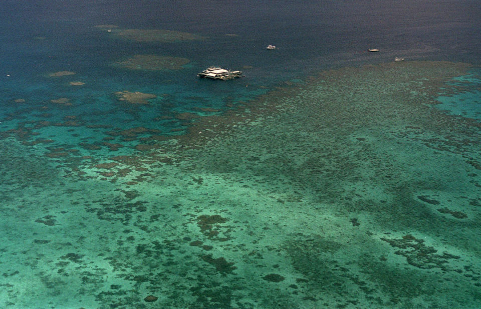 FILE - This Sept. 10, 2001, file photo shows Agincourt Reef, located about 30 miles off the coast near the northern reaches of the 1,200-mile long Great Barrier Reef. Climate change is increasingly damaging the U.N.’s most cherished heritage sites, a leading conservation agency warned Wednesday Dec. 2, 2020, reporting that Australia’s Great Barrier Reef and dozens of other natural wonders are facing severe threats. (AP Photo/Randy Bergman, File)