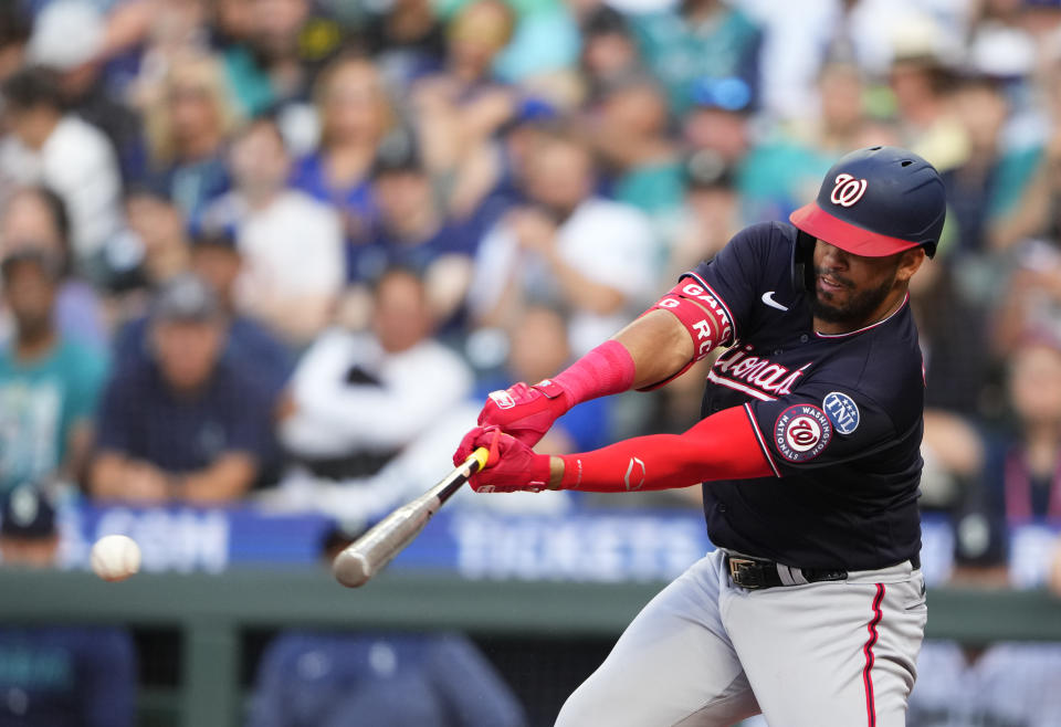 Washington Nationals' Luis Garcia hits an RBI single against the Seattle Mariners to score CJ Abrams during the third inning of a baseball game Monday, June 26, 2023, in Seattle. (AP Photo/Lindsey Wasson)