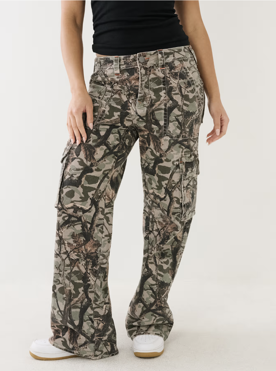 model wearing camo cargo pants with black top