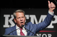 FILE - Republican Gov. Brian Kemp waves to supporters during an election night watch party, May 24, 2022, in Atlanta. Kemp easily turned back a GOP primary challenge Tuesday from former Sen. David Perdue, who was backed by former President Donald Trump. (AP Photo/John Bazemore, File)