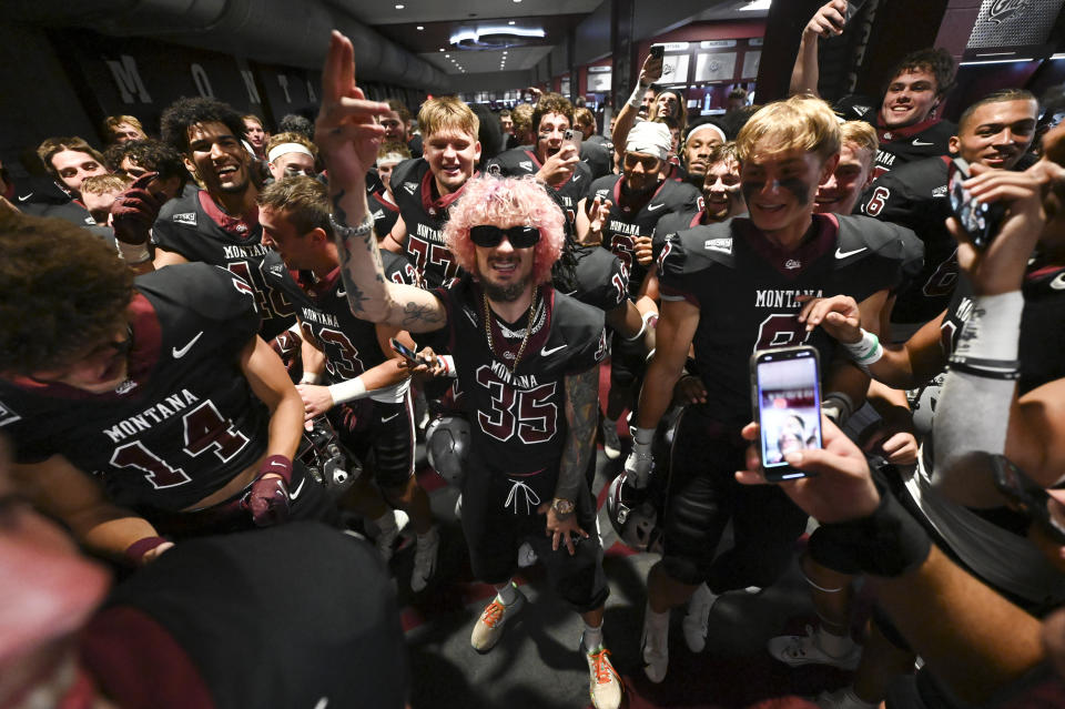 MISSOULA, MONTANA - SEPTEMBER 16: UFC bantamweight Sean O'Malley celebrates with the Montana Grizzlies after beating the Ferris State Bulldogs at Washington-Grizzly Stadium on September 16, 2023 in Missoula, Montana. (Photo by Tommy Martino/University of Montana/Getty Images)