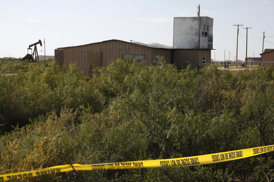 In this Monday, Sept. 2, 2019 photo, crime scene tape marks the home of Seth Ator, the gunman in a West Texas rampage Saturday, near Odessa, Texas. A neighbor said Ator would shoot from the elevated space at night and that they sometimes saw him carrying bloody rabbits. (AP Photo/Sue Ogrocki)