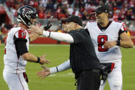 Atlanta Falcons head coach Dan Quinn, center, celebrates with quarterbacks Matt Ryan, left, and Matt Schaub (8) during the second half of an NFL football game against the San Francisco 49ers in Santa Clara, Calif., Sunday, Dec. 15, 2019. (AP Photo/John Hefti)