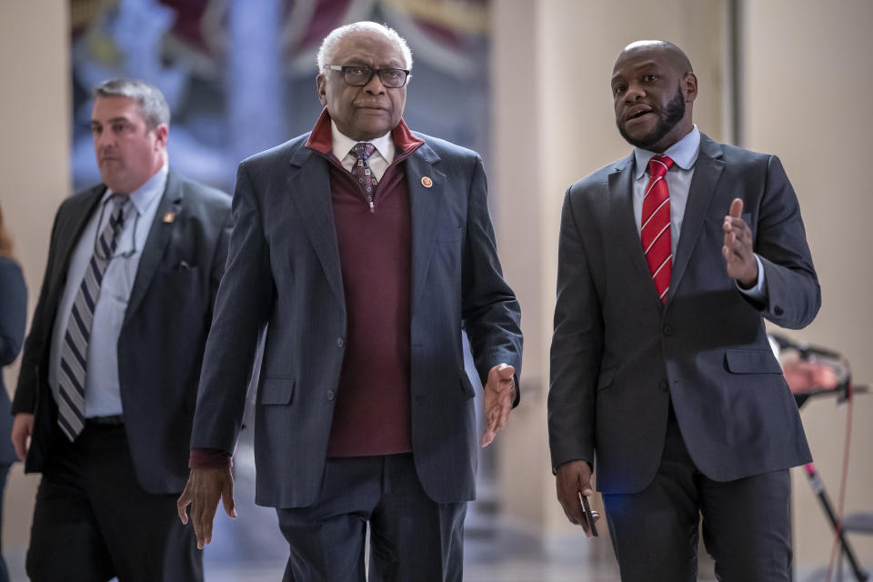 House Majority Whip James Clyburn, D-S.C., walks to the chamber as the House votes to hold former President Donald Trump advisers Peter Navarro and Dan Scavino in contempt of Congress over their months-long refusal to comply with subpoenas from the committee investigating the Jan. 6 attack, at the Capitol in Washington, Wednesday, April 6, 2022. (AP Photo/J. Scott Applewhite)