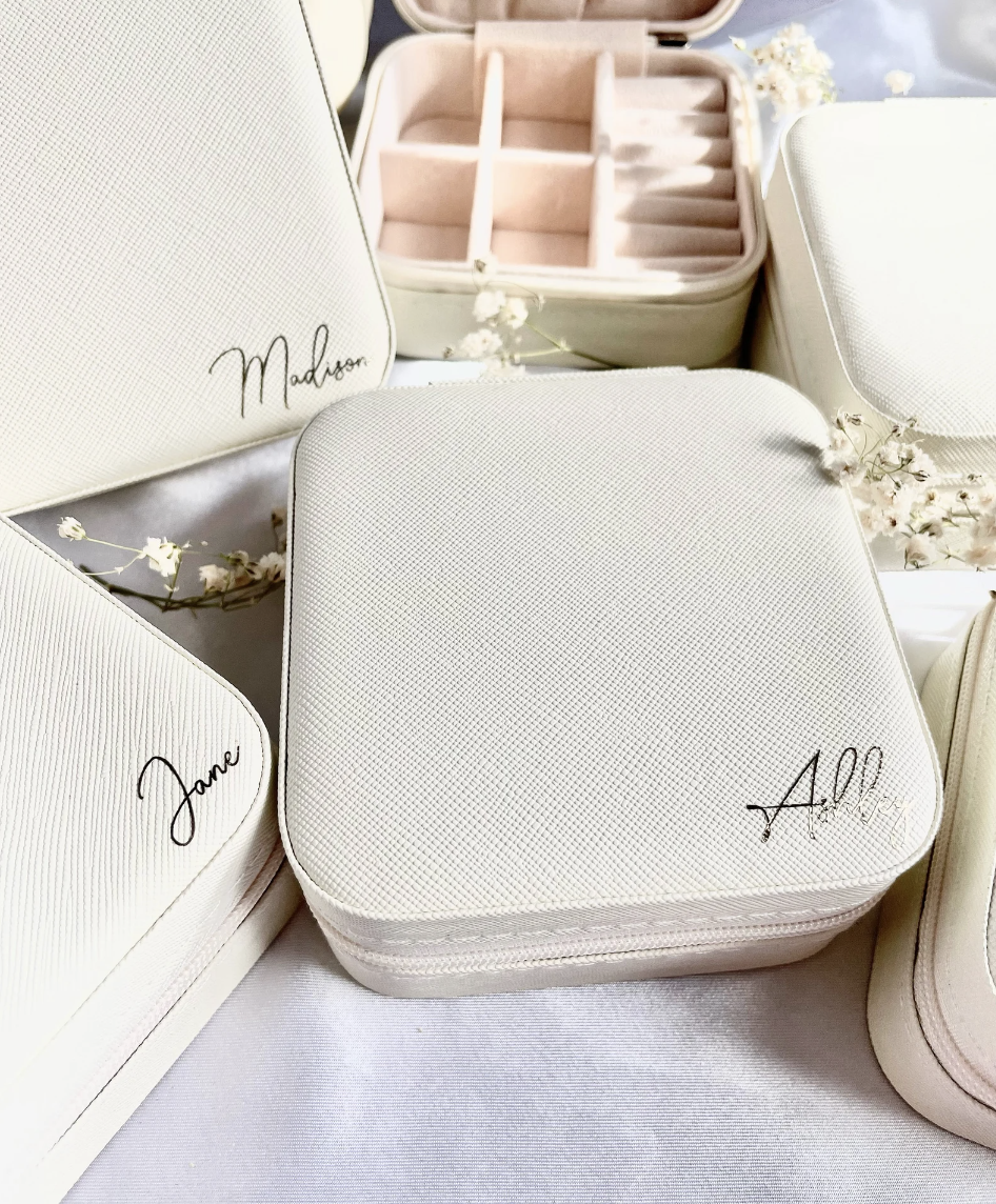 Personalized Travel Jewelry Case in white with names (Photo via Etsy)