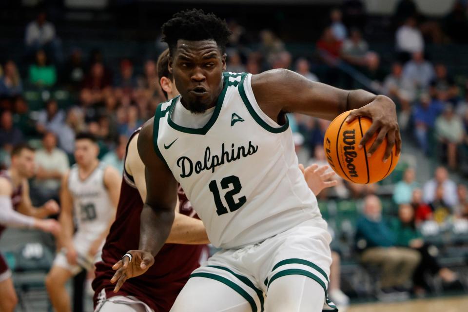 Jacksonville Dolphins forward Mike Marsh (12) handles the ball during the second half of an ASUN Conference mens basketball matchup Wednesday, Feb. 22, 2023 at Jacksonville University's Swisher Gymnasium in Jacksonville, Fla. The Bellarmine Knights defeated the Jacksonville Dolphins 63-61.

Jki 022223 Ju Bellarmine Basketball 23