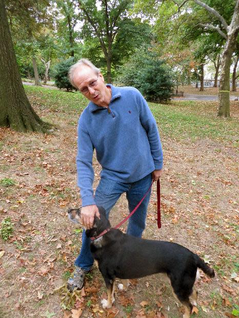 CORRECTS TO PHYSICIST, NOT PHYSICIAN - This Oct. 10, 2013 photo shows actor William Hurt with his dog Lucy in Riverside Park in New York. Hurt portrays Dr. Richard Feynman, in "The Challenger Explosion," a film about the world-renown physicist and Nobel laureate whose sharp mind and dogged spirit led him to the design flaw that caused the space shuttle Challenger to explode in 1986. The film airs Saturday, Nov. 16, at 9 p.m. EST. (AP Photo/Frazier Moore)