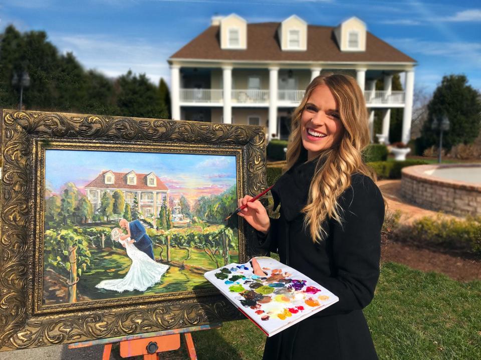 Heather Wolfe paints a live wedding portrait at Castleton Farms. Wolfe also offers paintings of weddings that have already happened, using favorite wedding photos.